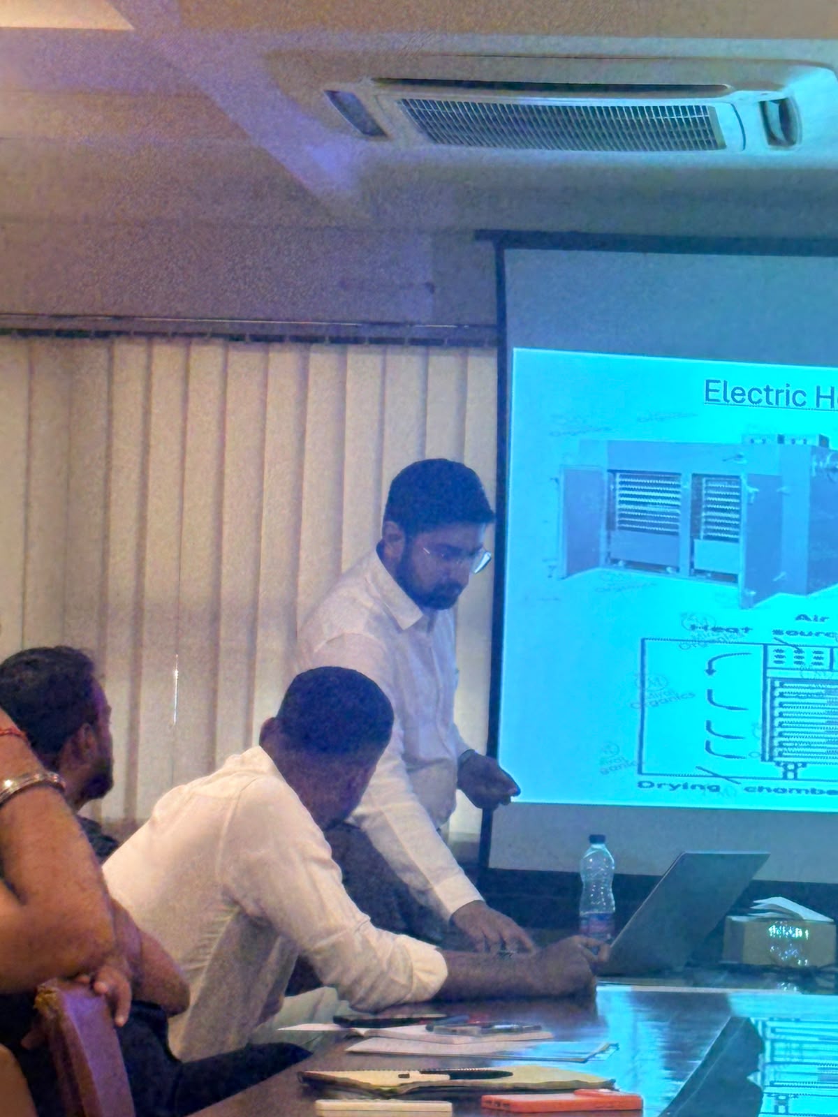 Electric tray dryer working explained at a food dehydration workshop