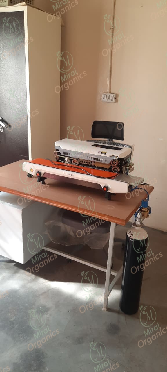 Nitrogen-flush pouch sealing machine used to pack dried fruit at the Mirai Organics facility