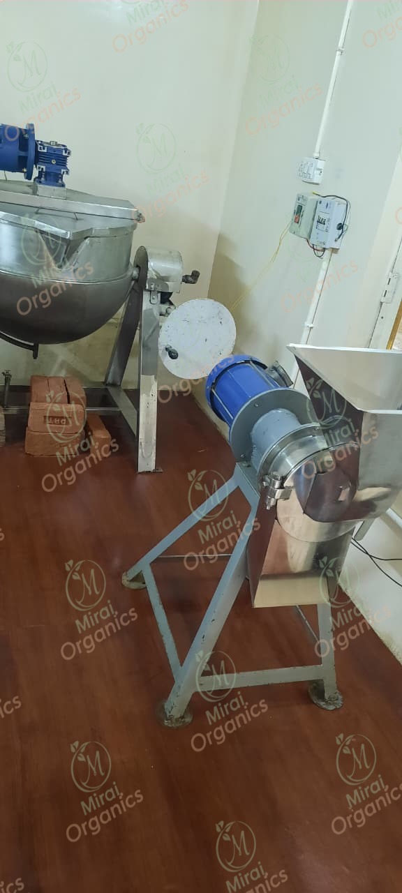 Kettle and grinder machinery inside the facility
